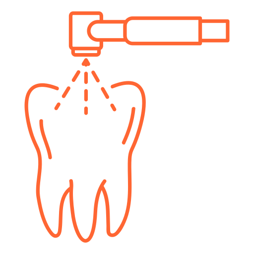 Dental drill cleaning a tooth, depicting a dental procedure with water spray from the drill