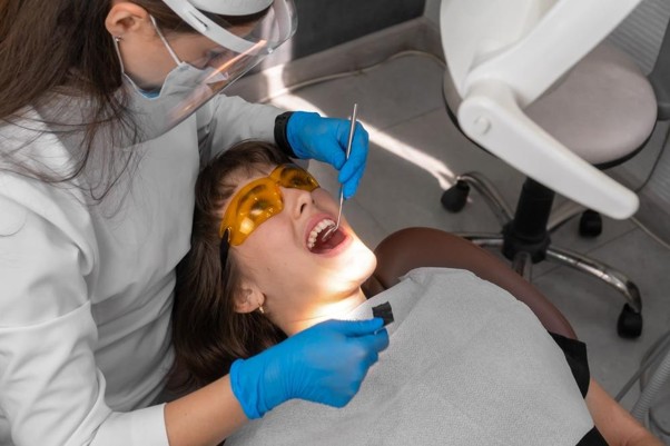 Picture3 Dentist checking bite alignment for sore tooth while chewing