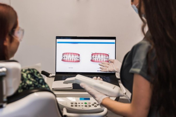 Picture3 Dentist checking bite alignment after filling to relieve toothache